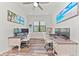 Spacious home office with dual work stations and large window at 13769 Old Creek Ct, Parrish, FL 34219
