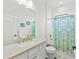 Clean bathroom with a bathtub, shower, and patterned curtain at 13769 Old Creek Ct, Parrish, FL 34219