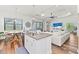 Open concept kitchen with island and breakfast bar, overlooking living area at 13769 Old Creek Ct, Parrish, FL 34219