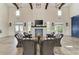 Community room with fireplace, seating area, and dining tables at 13769 Old Creek Ct, Parrish, FL 34219