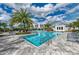 Community lap pool with plenty of lounge chairs at 13769 Old Creek Ct, Parrish, FL 34219