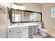 Bathroom with vanity, toilet, and large mirror at 4207 S Dale Mabry Hwy # 8312, Tampa, FL 33611