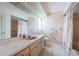 A bathroom with tile flooring and a shower/tub with a shell-patterned shower curtain at 11705 66Th N Ave, Seminole, FL 33772