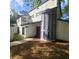 Unique contemporary home featuring stucco exterior, varied window styles and covered front entry at 2400 Pine Hammock, Clearwater, FL 33764