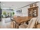 Open-concept dining area with natural light, stylish furniture, and views of the living room at 281 Villa Corte Dr, Lutz, FL 33549