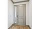 Elegant entryway with light wood floors and modern door with sidelight and neutral paint at 281 Villa Corte Dr, Lutz, FL 33549