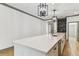 Bright kitchen features a large island with light countertops and wood-look flooring at 281 Villa Corte Dr, Lutz, FL 33549