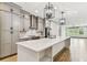 Spacious kitchen with a large island, stainless steel appliances, and modern lighting at 281 Villa Corte Dr, Lutz, FL 33549