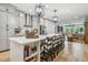 Open kitchen with a large island, bar stools, and stainless steel appliances at 281 Villa Corte Dr, Lutz, FL 33549