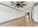 Bright living room displays hardwood flooring, recessed lighting, and contemporary ceiling fan at 281 Villa Corte Dr, Lutz, FL 33549