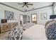 Tastefully decorated main bedroom with a king bed and an ensuite bathroom with a modern vanity at 281 Villa Corte Dr, Lutz, FL 33549