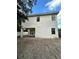 Back of a two-story white home with covered patio at 318 W Park Ave, Tampa, FL 33602