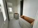 Bathroom featuring gray vanity cabinets and white penny tile flooring at 318 W Park Ave, Tampa, FL 33602