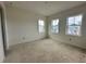 Bright bedroom featuring three windows that let in natural light at 318 W Park Ave, Tampa, FL 33602