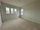Bright bedroom with three windows allowing natural light at 318 W Park Ave, Tampa, FL 33602