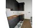 The kitchen features dark cabinetry ready for countertop installation at 318 W Park Ave, Tampa, FL 33602