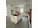 Bright, unfinished kitchen featuring white cabinets and a center island at 318 W Park Ave, Tampa, FL 33602