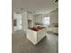 Kitchen being built with white cabinets, center island, and recessed lights at 318 W Park Ave, Tampa, FL 33602