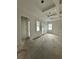 Bright living room featuring recessed lighting, tray ceiling and access to outdoors through windows and glass doors at 318 W Park Ave, Tampa, FL 33602