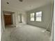 Bright, open-concept living room with large windows and fresh paint at 318 W Park Ave, Tampa, FL 33602