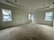 Spacious main bedroom with tray ceiling and three windows for plenty of light at 318 W Park Ave, Tampa, FL 33602