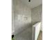 New shower features custom tile design and practical inset at 318 W Park Ave, Tampa, FL 33602