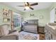 A delightful Bedroom featuring a gray crib, matching furniture, and charming decor for a warm and inviting space at 4474 Connery Ct, Palm Harbor, FL 34685