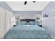 A calming bedroom with soft blue hues, inviting natural light, and peaceful backyard views for a restful retreat at 4474 Connery Ct, Palm Harbor, FL 34685