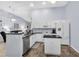 Modern kitchen with white cabinets, stainless steel appliances, and dark countertops is a great space for cooking at 4474 Connery Ct, Palm Harbor, FL 34685