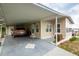 Tan mobile home with carport at 7154 El Meyers St, Zephyrhills, FL 33541