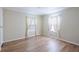 Light and airy bedroom with wood floor at 7154 El Meyers St, Zephyrhills, FL 33541