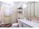 Clean bathroom with white vanity, mirror, and bathtub at 7154 El Meyers St, Zephyrhills, FL 33541