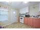 Pink and white kitchen with appliances at 7154 El Meyers St, Zephyrhills, FL 33541