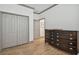 Spacious bedroom with a large dresser and double door closet at 281 Villa Corte Dr, Lutz, FL 33549