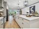 Open kitchen showcasing a large island and breakfast bar at 281 Villa Corte Dr, Lutz, FL 33549