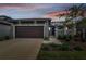 Attractive home exterior with a two-car garage at 281 Villa Corte Dr, Lutz, FL 33549