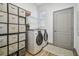 Laundry room with washer, dryer, and ample storage at 281 Villa Corte Dr, Lutz, FL 33549