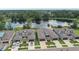 Luxury townhomes overlooking a peaceful lake; two-car garages and spacious yards at 281 Villa Corte Dr, Lutz, FL 33549