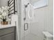 Modern bathroom with a frameless shower and hexagon tile floor at 281 Villa Corte Dr, Lutz, FL 33549