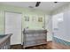 Bedroom with dresser, closet, and access to hallway at 4474 Connery Ct, Palm Harbor, FL 34685