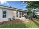 Spacious backyard with screened patio, grill, and grassy area at 4474 Connery Ct, Palm Harbor, FL 34685