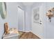 Bright entryway with wood-look floors and a small table at 4474 Connery Ct, Palm Harbor, FL 34685