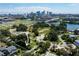 Aerial view showcases a vacant lot with a downtown cityscape in the background at 2203 Glenwood, Tampa, FL 33602
