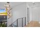 Hallway with modern lighting fixtures, a large window, and access to other rooms of the home at 2203 Glenwood, Tampa, FL 33602