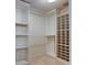 Large closet with built-in shelving and hanging rods at 7922 Sailboat Key S Blvd # 607, South Pasadena, FL 33707