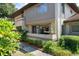 Ground level condo with private entrance, landscaping, and updated siding at 2935 Lichen Ln # C, Clearwater, FL 33760