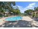 Community pool with lounge chairs and a relaxing atmosphere at 2935 Lichen Ln # C, Clearwater, FL 33760