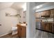 Small bathroom with wood vanity and updated fixtures at 2935 Lichen Ln # C, Clearwater, FL 33760