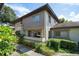Condo building with landscaping and walkway at 2935 Lichen Ln # C, Clearwater, FL 33760