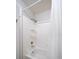Bathroom with shower/tub combo, white tile, and built in shelving at 2935 Lichen Ln # C, Clearwater, FL 33760